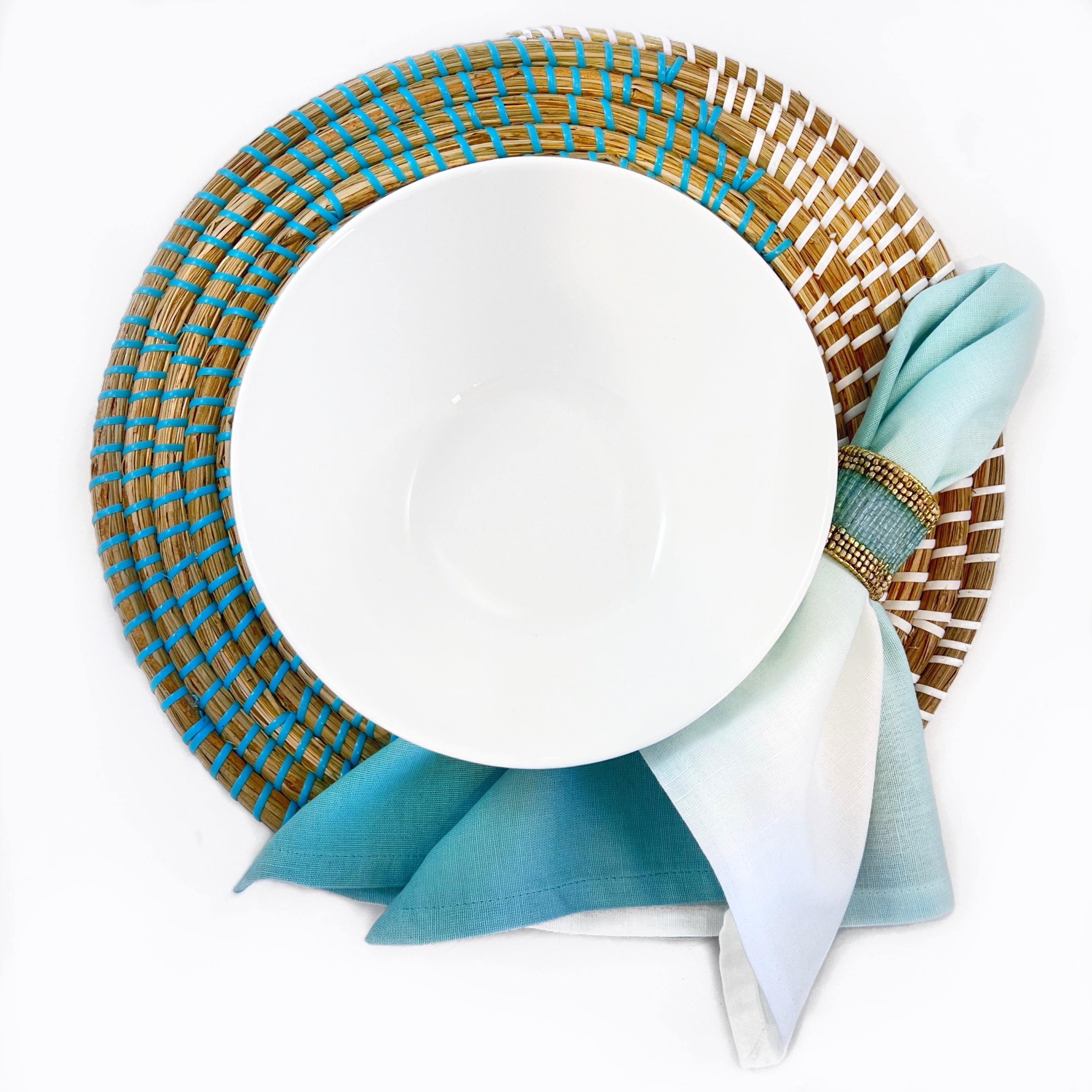 Tablescapes and  table accessories, beaded napkin rings, linen napkins and placemats.