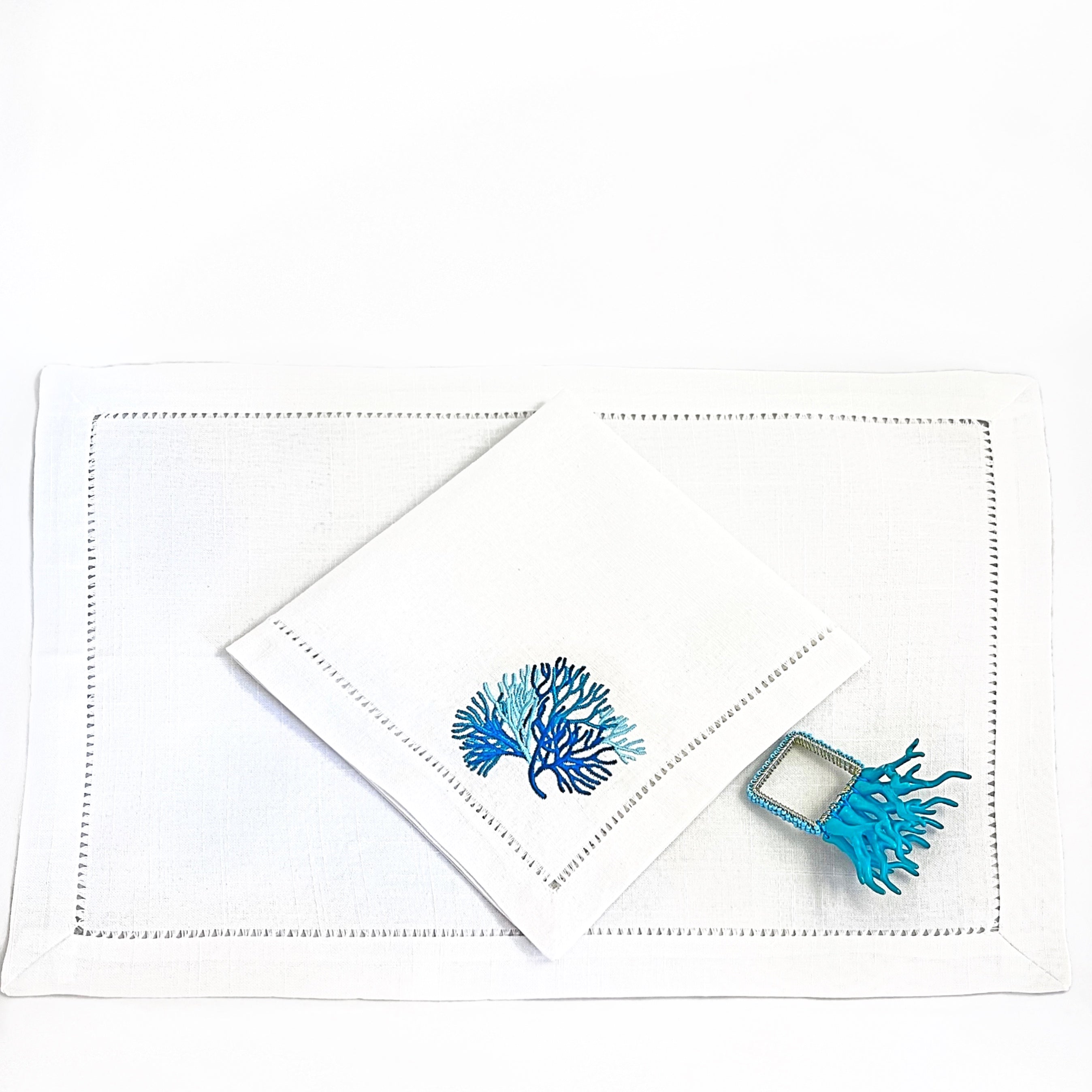 Tablescapes and table accessories, beaded napkin rings, linen napkins and placemats.