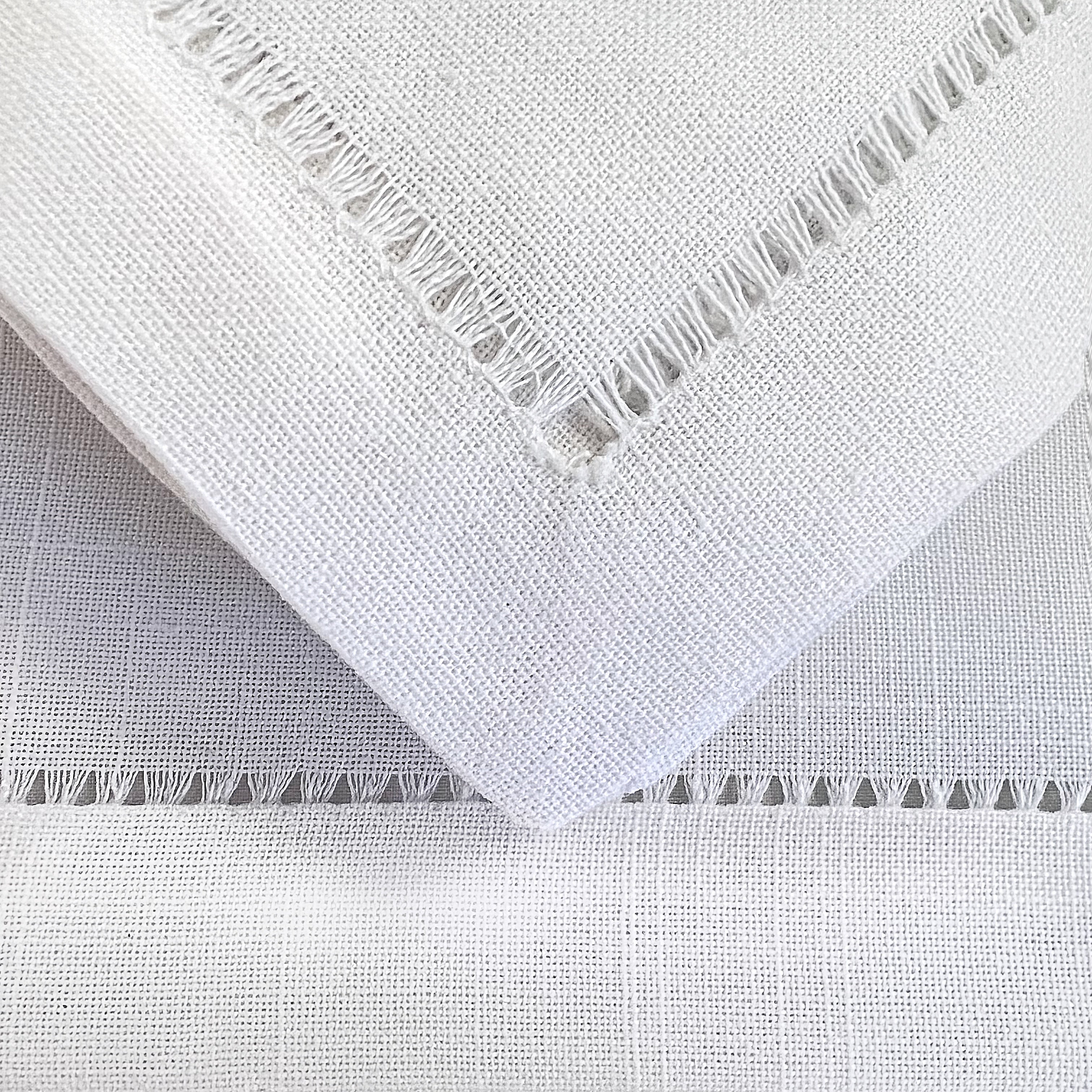 Tablescapes and table accessories, beaded napkin rings, linen napkins and placemats.