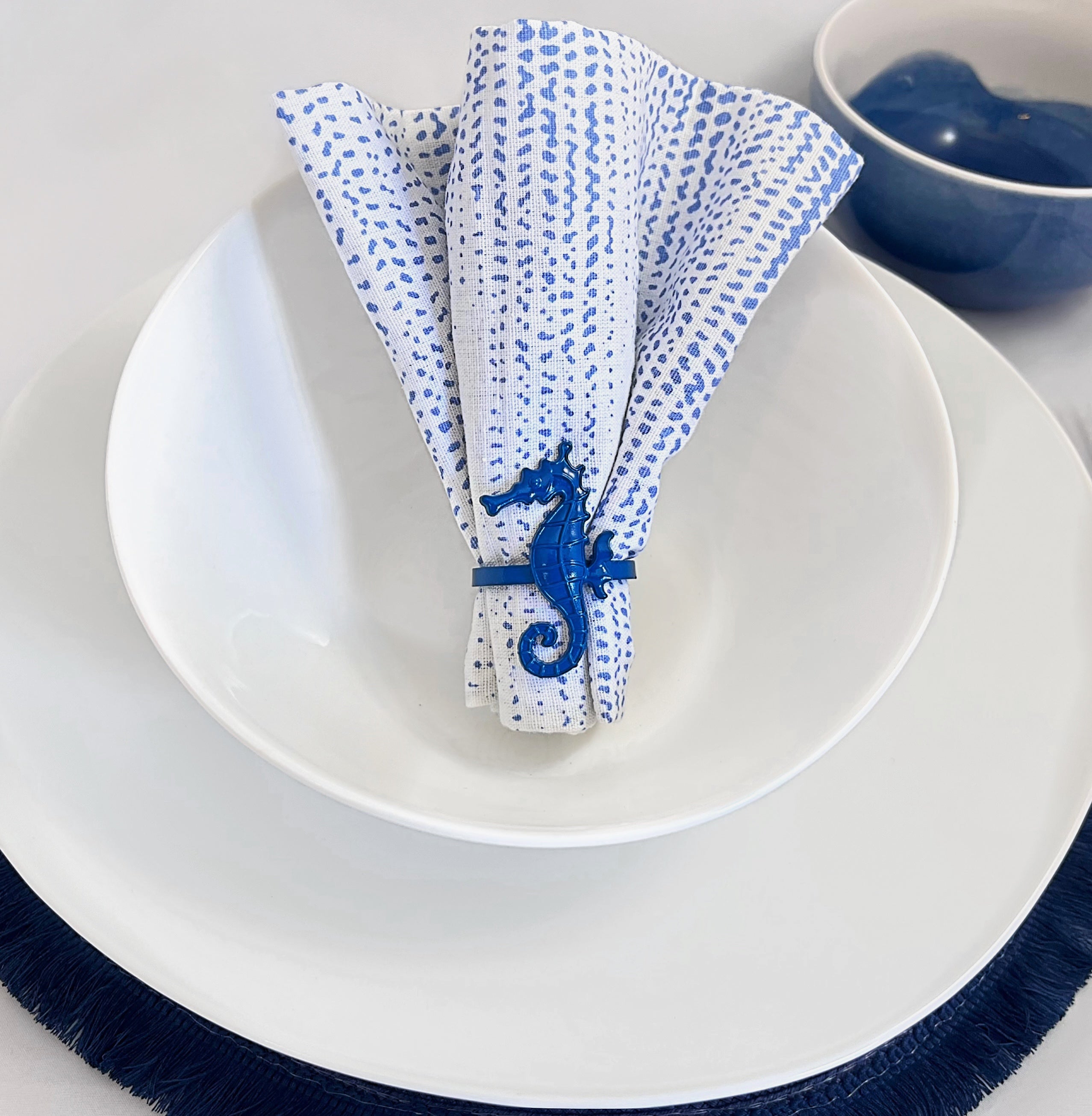 Tablescapes and  table accessories, beaded napkin rings, linen napkins and placemats.